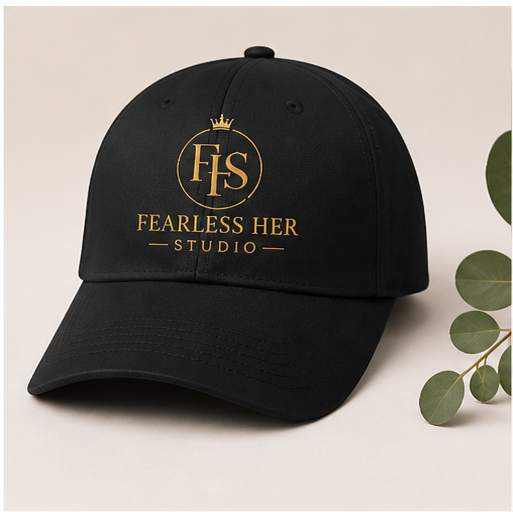 Black cap with 'Fearless Her Studio' logo on a light background